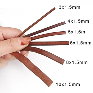 Brown DIY faux leather cords in multiple widths from 3mm to 10mm held by a hand