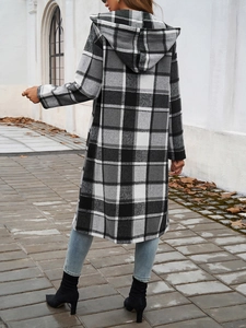 Rear view of long hooded color-block plaid jacket for women in autumn outdoor setting