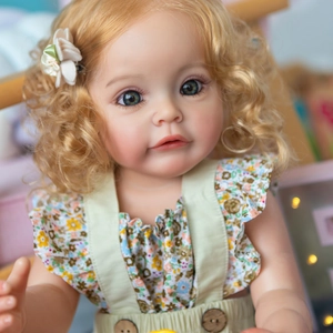55cm lifelike reborn baby doll with blonde curls and floral dress in a realistic portrait