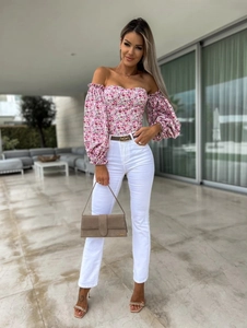 Floral off-the-shoulder crop top with puff sleeves paired with slim-fit white trousers
