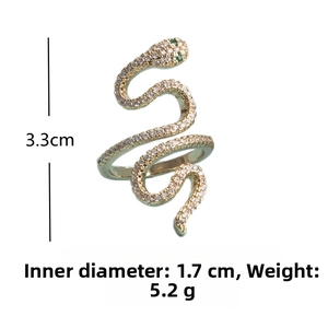 Detailed view of gold snake ring with white crystals and green stone eyes including dimensions