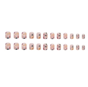 Detail of 24pcs short square press-on nails with colorful floral patterns and nude pink base