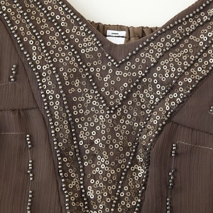 Bohemian dark brown mini dress featuring intricate V-shaped beadwork and sequins details