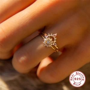 Close-up of S925 sterling silver V-shape opal and diamond ring set on a finger