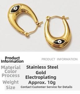 Macro detail of gold U-shaped evil eye earrings with size and 10g weight specifications