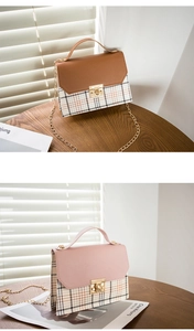 Detail view of plaid patchwork handbags with gold twist lock and chain strap