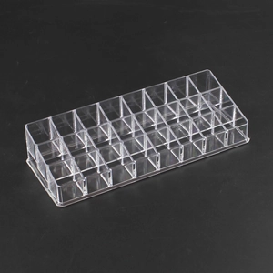 Macro shot of the multi-slot transparent acrylic storage box for lipsticks