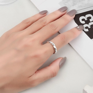 Irregular hammered texture open ring in silver finish worn by a model for a daily look