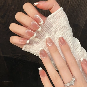 Elegant French press-on nails with nude pink gradient and white tips for women