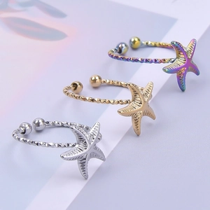 Detailansicht von Seestern-Ringen in Gold Silber und Regenbogen mit strukturiertem Band