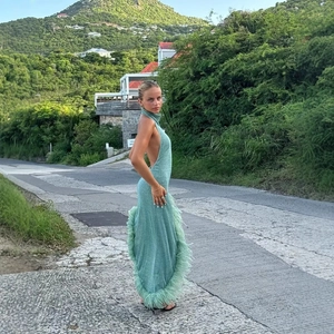 Elegant sea green halter neck backless dress with ostrich feather hem for party wear