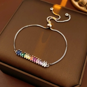 Macro shot of adjustable silver bracelet featuring rainbow baguette-cut zircon gemstones