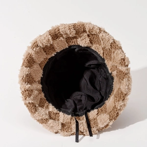 Checkerboard plush bucket hat with brown faux fur texture and adjustable inner lining