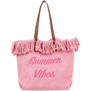 Detailed texture of pink woven tote bag with Summer Vibes embroidery and fringe tassels