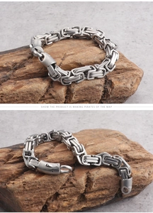 Macro detail of men's Byzantine titanium steel chain bracelet with industrial clasp