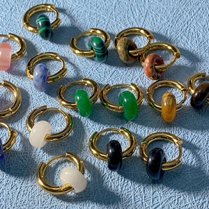 18k gold plated stainless steel hoop earrings with natural stone beads on blue fabric