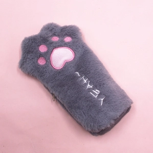 Close-up of a grey plush cat paw pencil case with pink embroidered heart-shaped paw pads