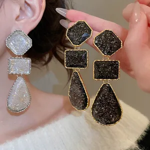 Vintage geometric resin drop earrings with gold foil accents and three-tier hanging design