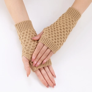 Detail of camel knitted fingerless gloves showing diamond stitch pattern and texture