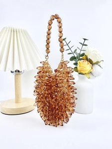 Detail of amber acrylic beaded teardrop bag with unique handcrafted hedgehog texture