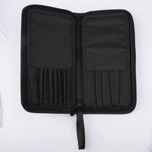 Detail view of large black makeup brush organizer with elastic slots and zip closure