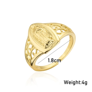Macro view of gold plated Virgin Mary relief on the band with hollow pattern
