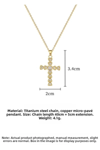 Detailed view of gold cross pendant with cubic zirconia and dimension measurements