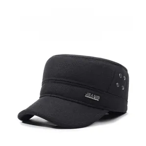 Detail of winter thermal wool flat top hat with earflaps and metal side brand plate