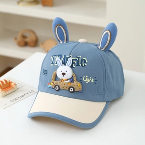 Detail of blue kids baseball cap with 3D bunny ears and cartoon car patch embroidery
