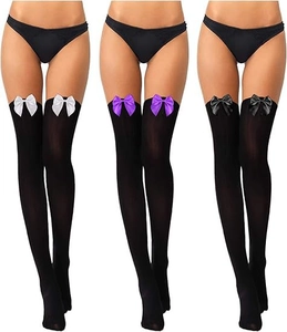 Detailed view of velvet over-knee stockings with black, purple, and white bows