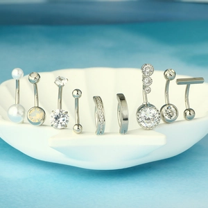9-piece stainless steel belly button ring set with zircon and pearl in a shell plate