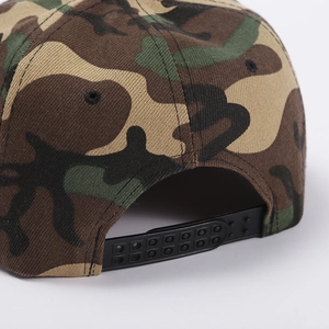 Detail of camouflage baseball cap showing black plastic snapback closure and stitching