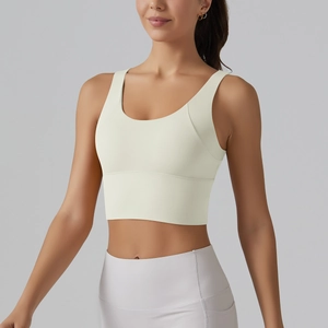 Front detail of a cream U-neck sports bra with wide straps and high elasticity