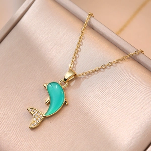 Golden dolphin necklace with green gemstone and sparkling zircon stones for women