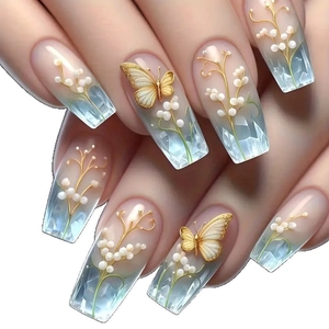 Faux ongles French avec papillons dorés 3D, perles et finition cristal bleu
