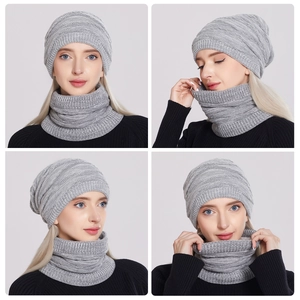 Close-up of gray chunky knit winter hat and neck warmer set with ribbed texture details