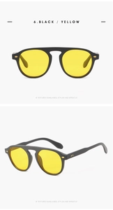 Vertical view of black textured sunglasses with yellow lenses from front and side angles