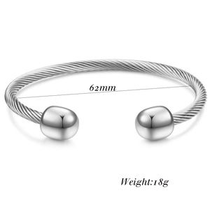 Detailed view of silver cable wire open bangle with 62mm diameter and polished beads