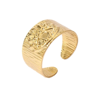Detailed view of tree bark texture and evil eye relief on the 18k gold plated open ring