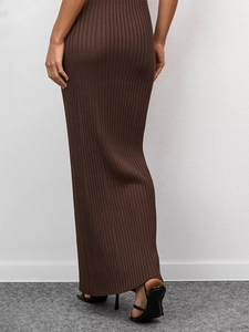 Detail view of dark brown ribbed knit maxi dress showing slim fit and textured fabric