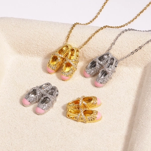 Detailed close-up of ballet slipper pendants with pink enamel and sparkling rhinestones