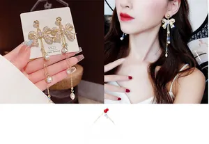 Detail of luxury S925 silver needle bowknot earrings with rhinestones and pearls