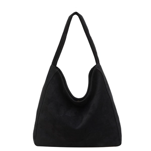 Minimalist black suede tote bag with a soft silhouette and single shoulder strap