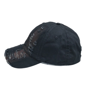Close-up of vintage distressed baseball cap with ripped details and frayed edge