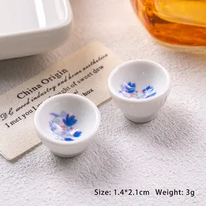 Macro detail of miniature blue and white ceramic bowls with 1.4 by 2.1cm size markings