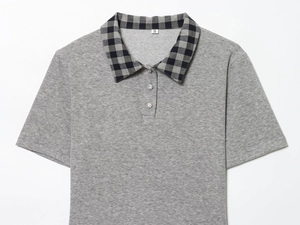 Detail of grey polo top with plaid collar and crystal buttons showing the size S label