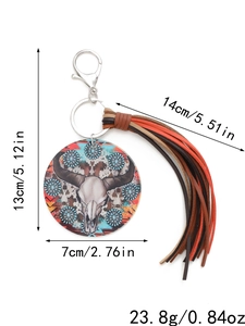 Detailed view of acrylic bull skull keychain with fringe, including size measurements
