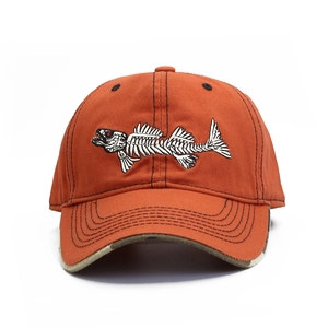 Burnt orange baseball cap with fish bone embroidery and camouflage underbrim detail
