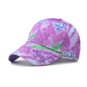 Detailed side view of abstract purple and green gradient tie-dye baseball cap fabric