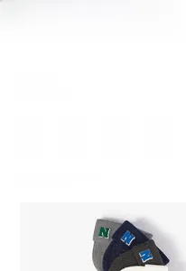 Detail view of winter knitted beanie with embroidered N letter patch in various colors